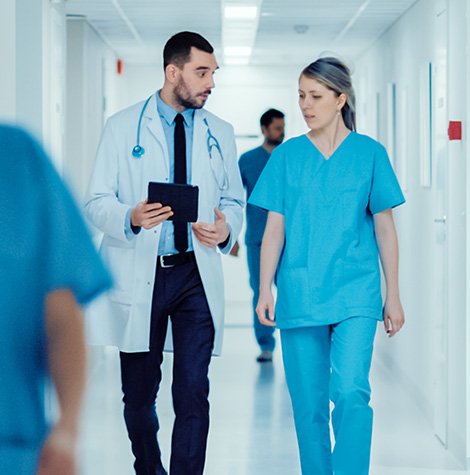 Doctor greeting a patient; replace with a clinic care photo